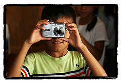 boy taking photograph